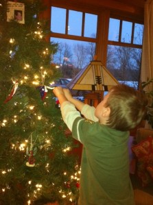 Bennett hangs an ornament!