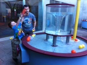 Bennett loved throwing balls into this water whirlpool.