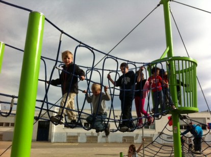 Bennett leads the troop across the rope bridge at the new playground.
