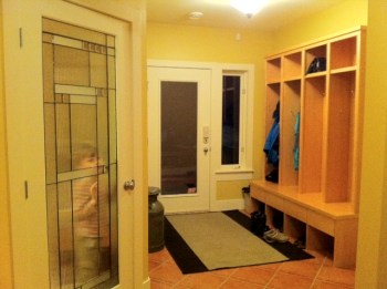 We walled in the TV room and added this art-glass door. The return of our entry lockers = bliss!