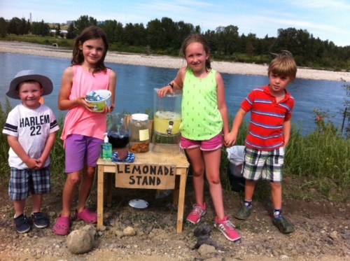 Selling lemonade, iced tea and cookies at a stand along the Bow River in Inglewood.
