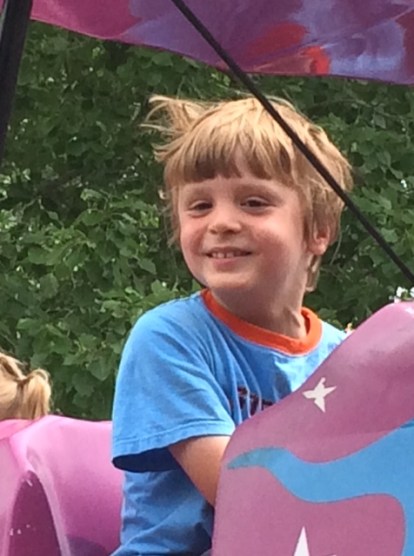 On the airplane ride at the Calaway Park kiddie zone.