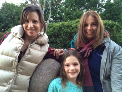 The gals enjoy an evening stroll along Turtle Creek in Dallas.