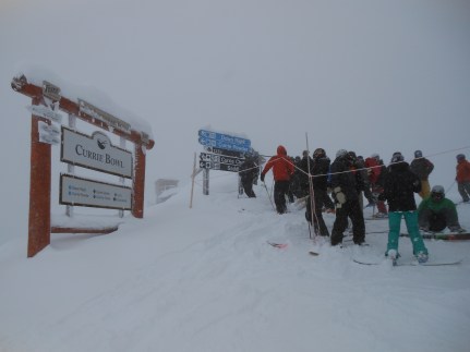 The throng gathers at the top of Currie Bowl on a powder morning, waiting for the sign line to come down.