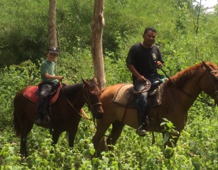 Bennett enjoys his first real trail ride in Belize.